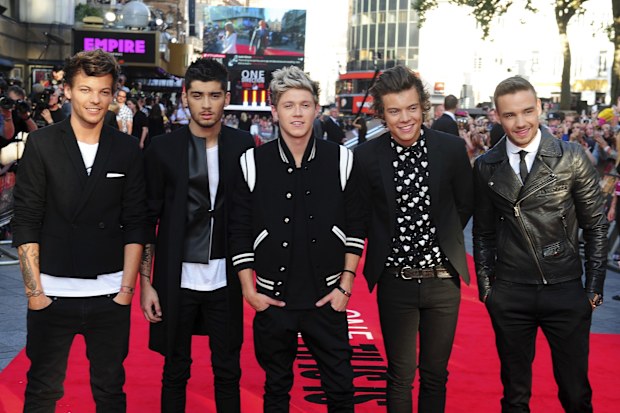 FILE - Louis Tomlinson, from left, Zayn Malik, Niall Horan, Harry Styles and Liam Payne arrive for the World Premiere of "One Direction: This Is Us," at the Empire Leicester Square, in London, Aug. 20, 2013. (Ian West/PA via AP, File)