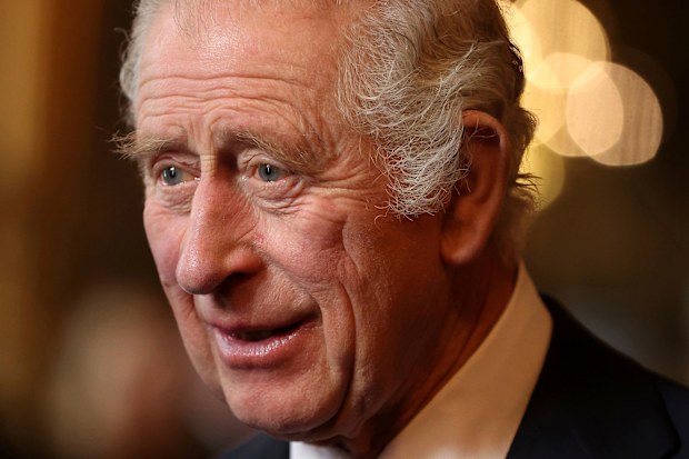 King Charles III speaks with guests during a reception and ceremony commemorating the 50th anniversary of the Resettlement of British Asians from Uganda in the UK, at Buckingham Palace in London, Wednesday Nov. 2, 2022 