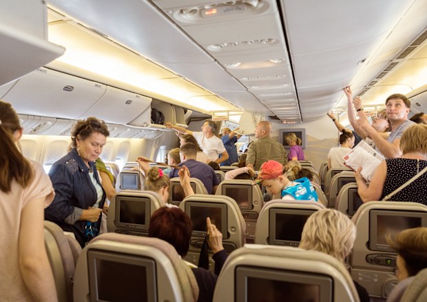 Burgas, Bulgaria - June 24, 2019: Passengers of the charter flight from St. Petersburg are preparing to leave the plane after landing