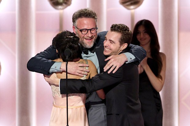 Zoë Kravitz and Dave Franco present the Best Performance by a Lead Actor in a TV Series  Musical or Comedy Award for "The Studio" to Seth Rogen (C) onstage during the 83RD ANNUAL GOLDEN GLOBES®, airing live from the Beverly Hilton in Beverly Hills, California on Sunday, January 11, 2026 at 8 PM ET/5 PM PT, on CBS and streaming on Paramount+. Photo: Kevork Djansezian/CBS ©2026 CBS Broadcasting, Inc. All Rights Reserved.