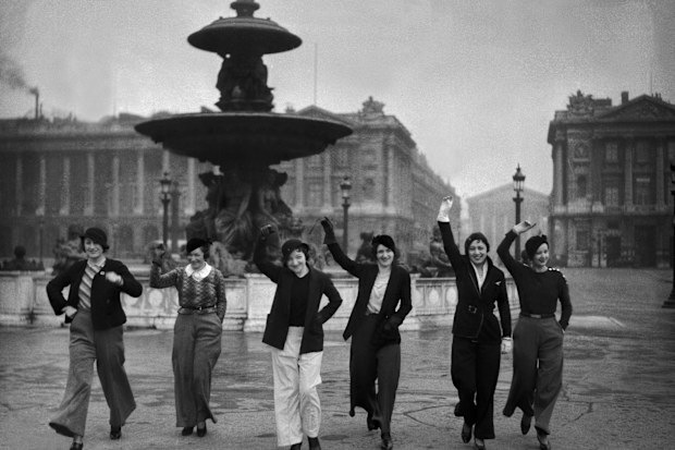 A group of models in Paris show off the city's latest trend, flared trousers, in February 1933.