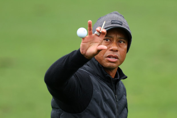 AUGUSTA, GEORGIA - APRIL 08: Tiger Woods of the United States catches a ball on the practice area during the third round of the 2023 Masters Tournament at Augusta National Golf Club on April 08, 2023 in Augusta, Georgia. (Photo by Andrew Redington/Getty Images)