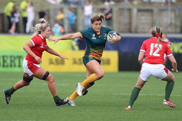 Grace Hamilton of Australia runs the ball during the Pool A Rugby World Cup 2021 match between Australia and Wales