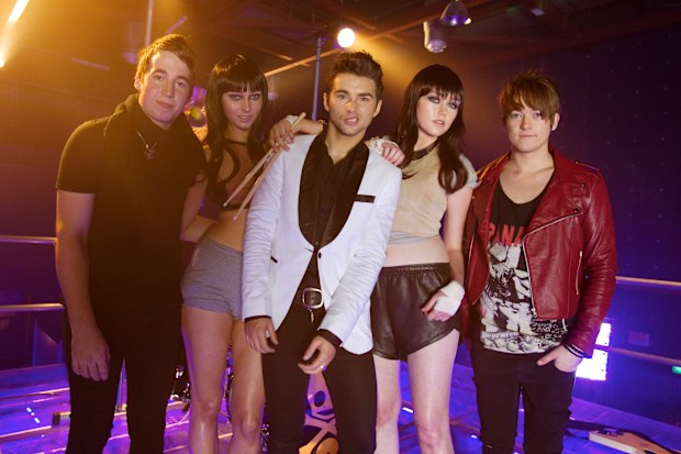 Band Short Stack with two contestants from Next Top Model on the set of the 'Bang Bang Sexy' music video.