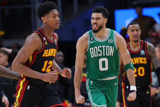 ATLANTA, GEORGIA - APRIL 27:  Jayson Tatum #0 of the Boston Celtics reacts after dunking the ball on a rebound against the Atlanta Hawks during the fourth quarter of Game Six of the Eastern Conference First Round Playoffs at State Farm Arena on April 27, 2023 in Atlanta, Georgia.  NOTE TO USER: User expressly acknowledges and agrees that, by downloading and or using this photograph, User is consenting to the terms and conditions of the Getty Images License Agreement.  (Photo by Kevin C. Cox/Gett