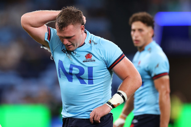 Angus Bell walks from the field after suffering a season-ending injury. 