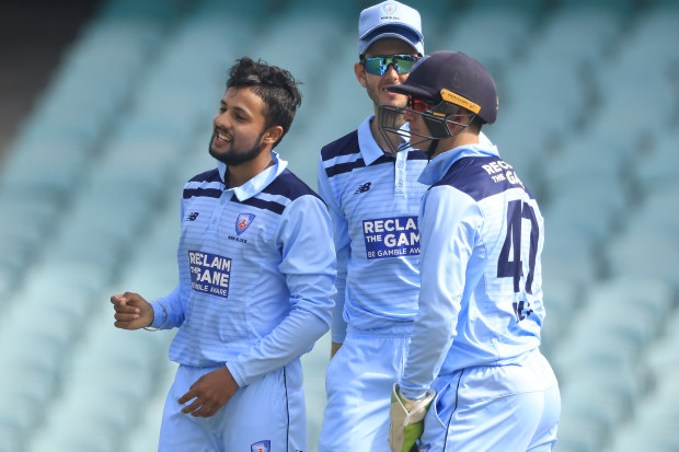 Tanveer Sangha of New South Wales celebrates the wicket of Matt Short of Victoria.