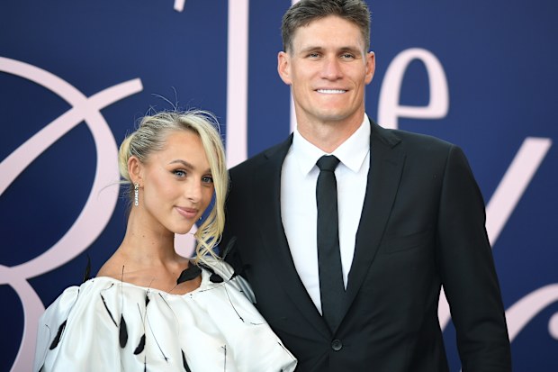 Lexi and Rory Lobb pose for a photo during 2024 Derby Day at Flemington Racecourse on November 2, 2024 in Melbourne, Australia. 