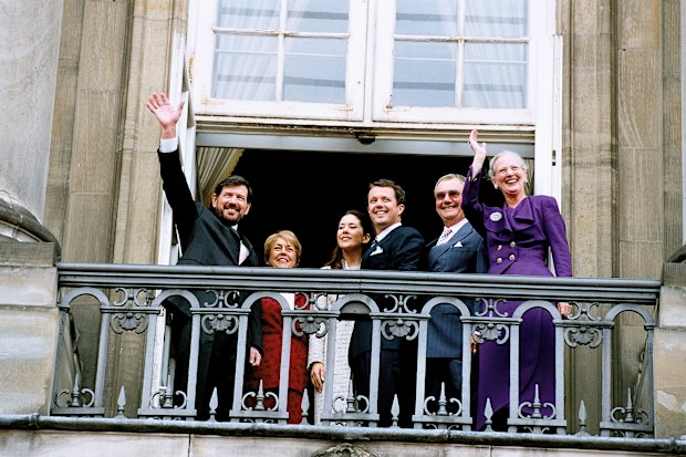 The engagement of Denmark's Crown Prince Frederik and Mary Donaldson, with her father John Donaldson and Queen Margrethe II on the Amalienborg Palace balcony October 8, 2003     