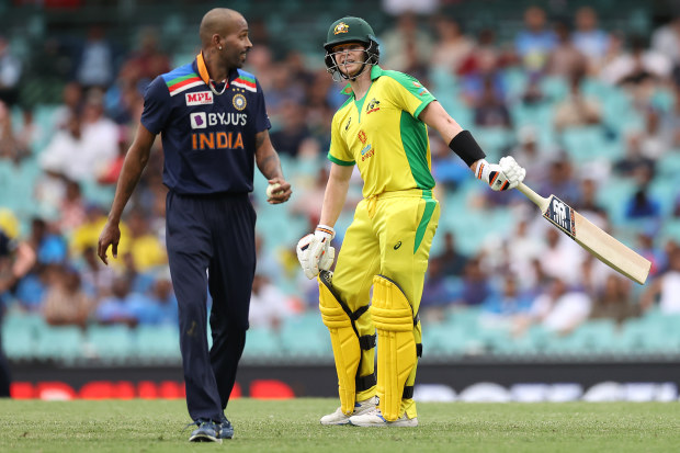 Steve Smith of Australia speaks to Hardik Pandya of India.