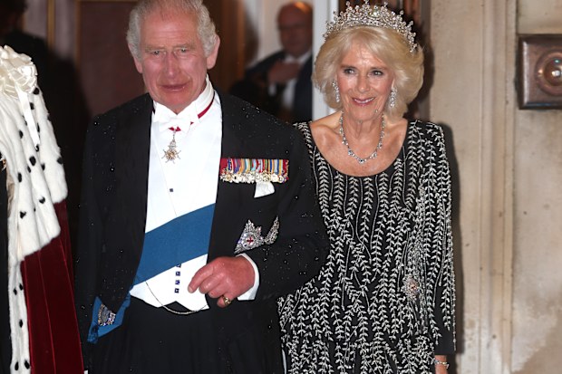 Queen Camilla listens to King Charles III addressing assembled guests at Mansion House in London, Wednesday, Oct. 18, 2023. Camilla is wearing the Girls of Great Britain and Ireland tiara and the South African diamond necklace and bracelet.