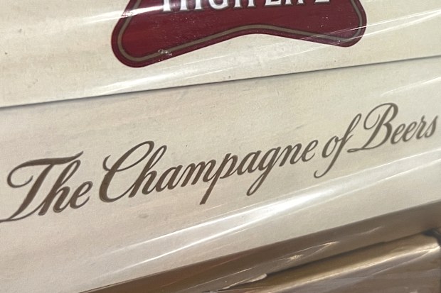 A label on the side of a carton of Miller High Life beer at the Westlandia plant in Ypres, Belgium, Monday, April 17, 2023.  