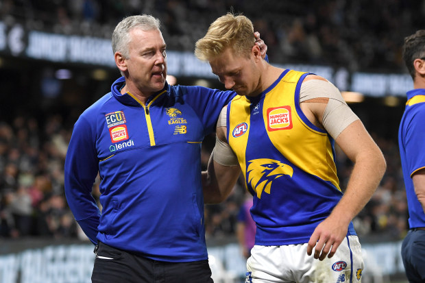 MELBOURNE, AUSTRALIA - JULY 22: Adam Simpson, Senior Coach of the Eagles and Oscar Allen of the Eagles react following the 2023 AFL Round 19 match between the Carlton Blues and the West Coast Eagles at Marvel Stadium on July 22, 2023 in Melbourne, Australia. (Photo by Morgan Hancock/AFL Photos via Getty Images)