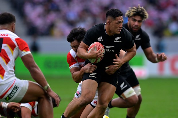 Roger Tuivasa-Sheck is tackled by Ryohei Yamanaka of Japan in their closely fought match at National Stadium in Tokyo.