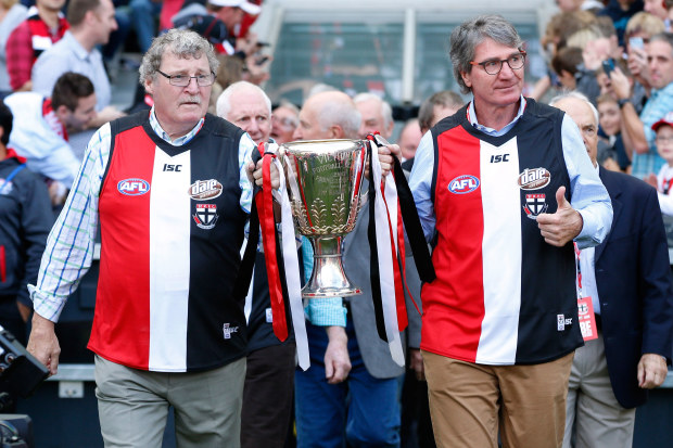 1966 Premiership players Kevin 'Cowboy' Neale and Barry Breen bring out the 1966 Premiership cup in 2016.