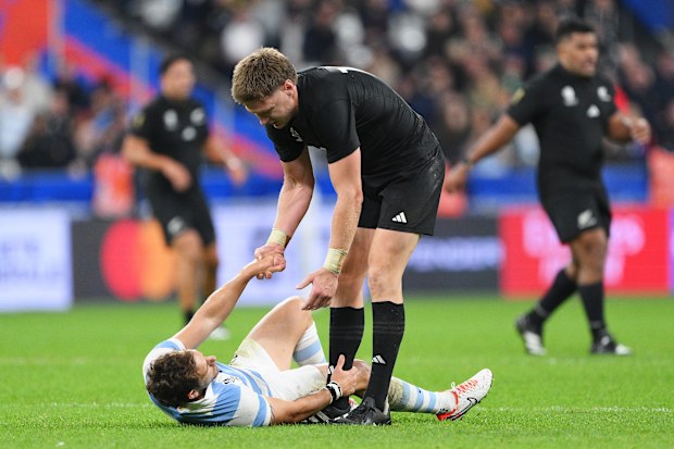 Nicolas Sanchez of Argentina is consoled by Jordie Barrett.