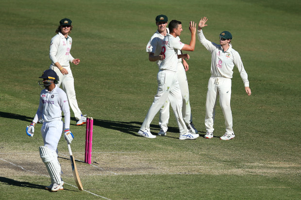 Josh Hazlewood of Australia celebrates after taking the wicket of Shubman Gill of India.