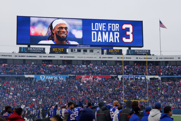 The scoreboard depicts a message of support for Damar Hamlin.