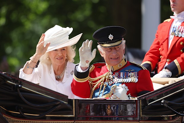 LONDON, ENGLAND - JUNE 14: King Charles III and Queen Camilla during Trooping The Colour 2025 on June 14, 2025 in London, England. Trooping The Colour is a ceremonial parade celebrating the official birthday of the British Monarch. The event features over 1,400 soldiers and officers, accompanied by 200 horses. More than 400 musicians from ten different bands and Corps of Drums march and while performing. (Photo by Neil Mockford/Getty Images)