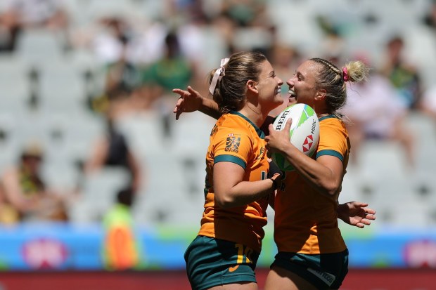 Australia's Isabella Nasser and Teagan Levi celebrate a try. Photo: Mike Lee/KLC Fotos