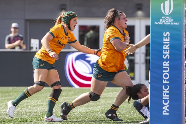 Eva Karpani of Australia celebrates her first half try.