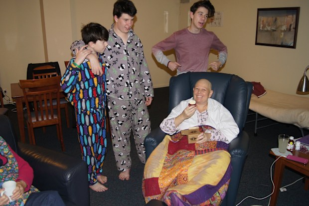 Jacob Boutcher with his mum Jodie, after her cancer diagnosis, and two elder brothers.