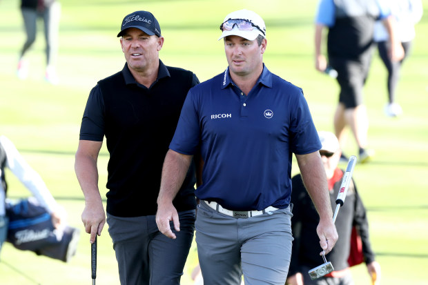 Shane Warne and Ryan Fox look on during day one of the 2020 New Zealand Golf Open at The Hills.