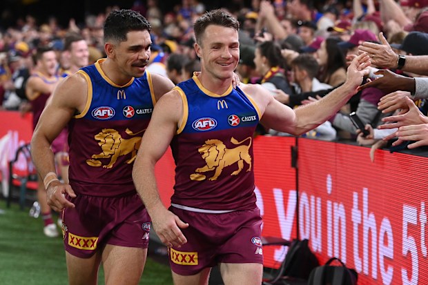 Charlie Cameron (left) and Lincoln McCarthy greet fans after Brisbane's preliminary final win against Carlton.