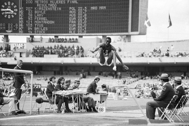 American long jumper Bob Beamon breaks the world record at the 1968 Olympics.
