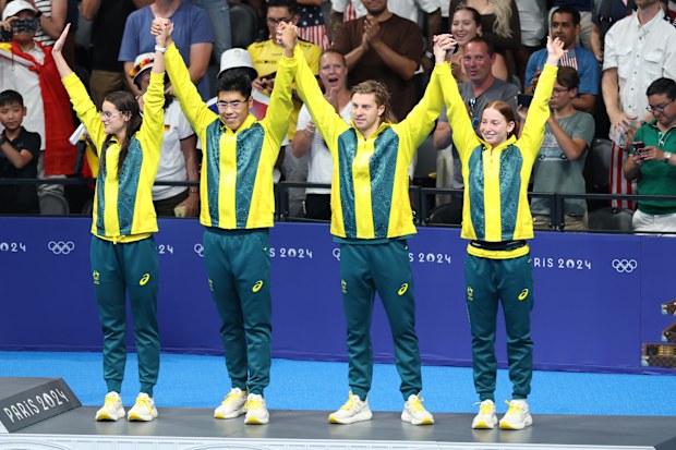 Team Australia celebrates bronze at the podium after the Swimming - Mixed 4 x 100m Medley Relay Final on day 8 of Paris 2024.