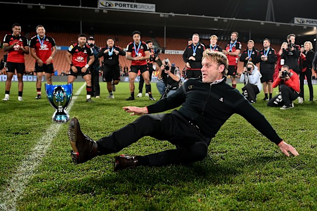 Coach Scott Robertson of the Crusaders breakdances after winning.