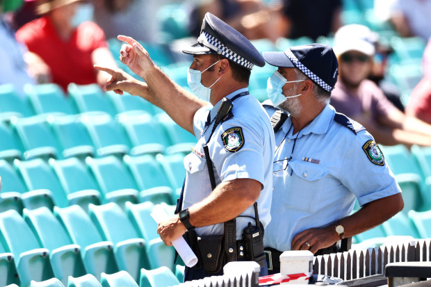 Police monitor the crowd following a complaint by Mohammed Siraj of India.