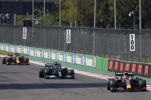 Red Bull driver Max Verstappen, of The Netherlands, leads the race, with Mercedes driver Lewis Hamilton, of Britain, during the Formula One Mexico Grand Prix.