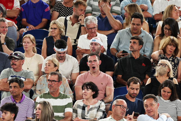 A fan among the crowd yawns mid-way through the quarter-final between Jannik Sinner and Andrey Rublev.