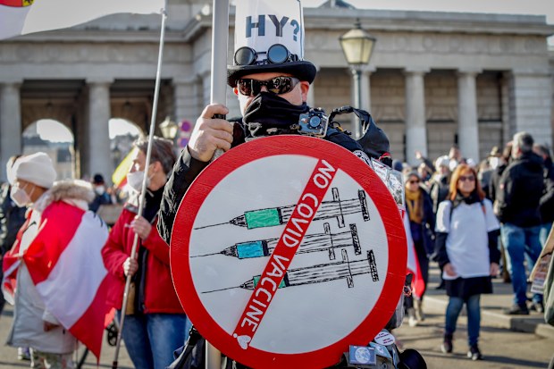 People take part in a demonstration against the country's coronavirus restrictions in Vienna, Austria