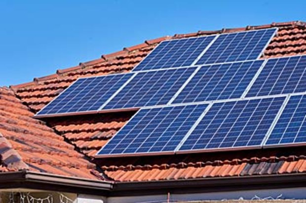Solar panels on top of house (Getty)