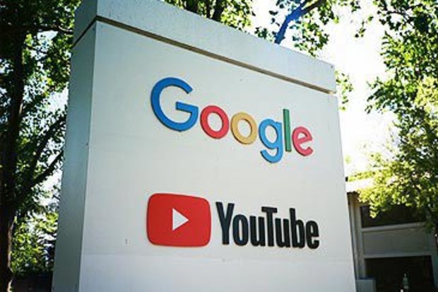 Sign displaying Google and YouTube logos at Googleplex, Mountain View (Smith Collection/Getty)