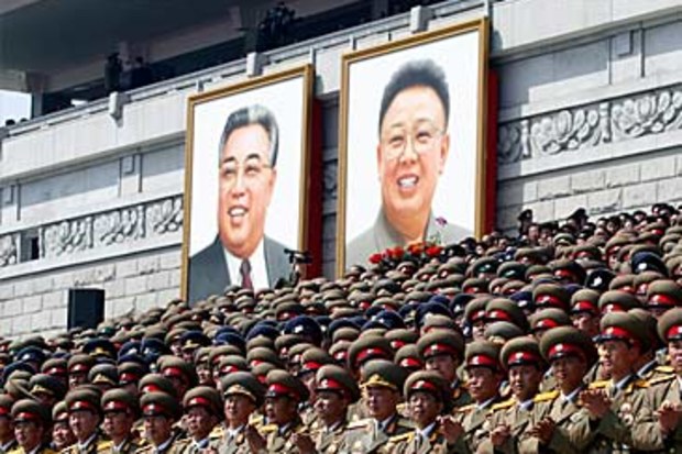 Portraits of Kim Il-sung and Kim Jong-il at parade (Getty)