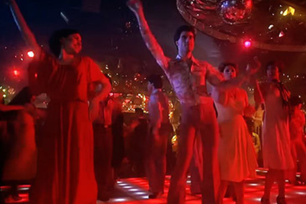 John Travolta in Saturday Night Fever 'Night Fever' line dance scene (Paramount)