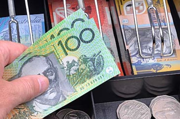 Money in cash register (Getty)