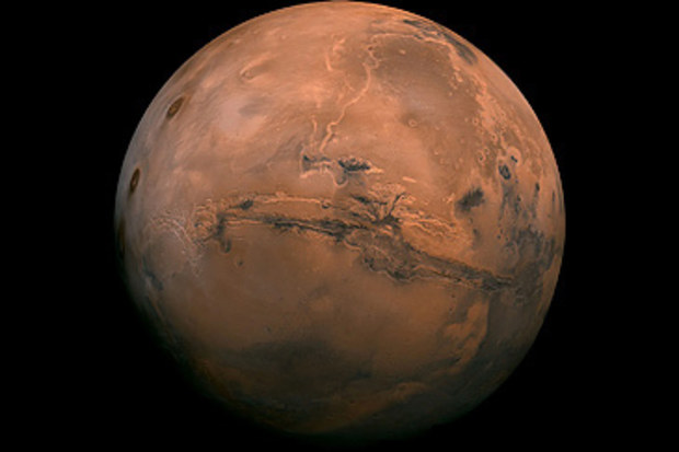 Mars with view of Valles Marineris canyon system (NASA)