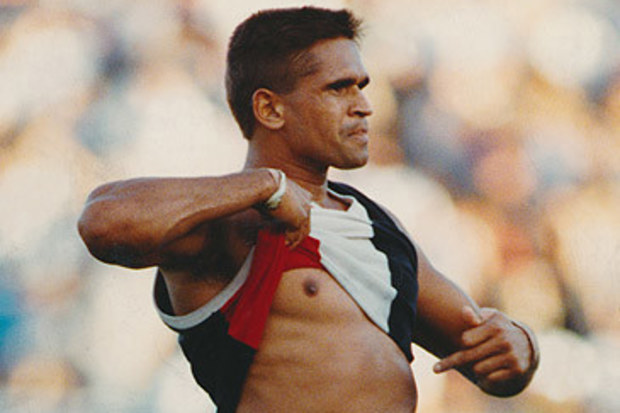 Nicky Winmar bares chest at opposition football fans in 1993 (Wayne Ludbey/The Age)