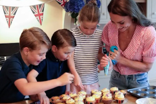 Prince George, Prince Louis and Princess Charlotte help Kate decorate the cupcakes