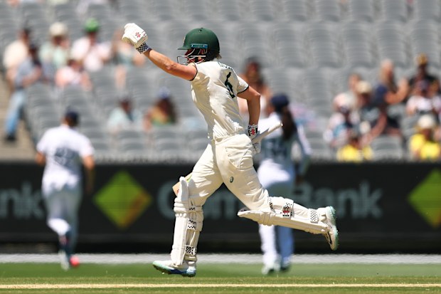 Beth Mooney of Australia celebrates scoring a century on day three.