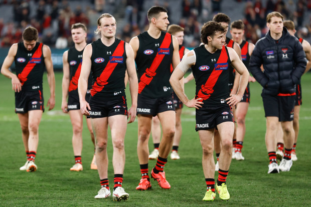 MELBOURNE, AUSTRALIA - AUGUST 25: The Bombers look dejected after a loss during the 2023 AFL Round 24 match between the Essendon Bombers and the Collingwood Magpies at Melbourne Cricket Ground on August 25, 2023 in Melbourne, Australia. (Photo by Michael Willson/AFL Photos via Getty Images)