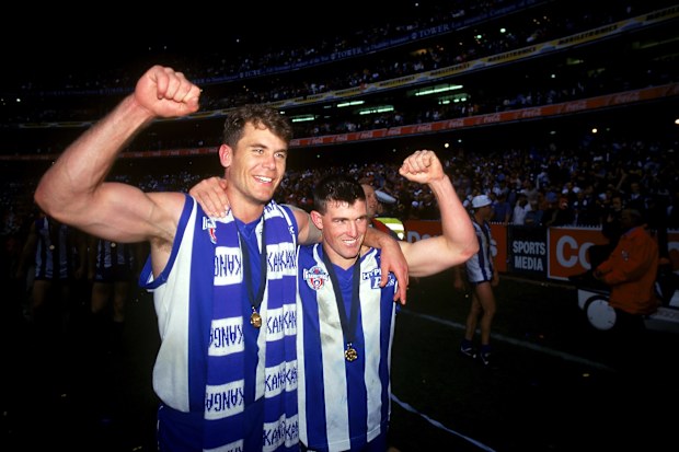 Wayne Carey and Anthony Stevens of the Kangaroos celebrate their premiership in 1996.