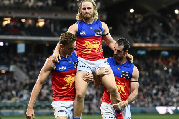 GEELONG, AUSTRALIA - APRIL 08: Daniel Rich of the Lions is chaired off the field in his 250th match during the round four AFL match between the Geelong Cats and the Brisbane Lions at GMHBA Stadium on April 08, 2022 in Geelong, Australia. (Photo by Quinn Rooney/Getty Images)