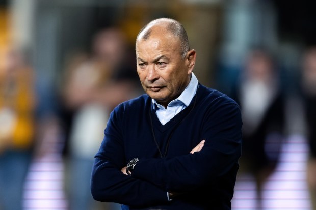 Eddie Jones watches the forwards warm up at CommBank Stadium.