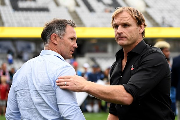 Leon MacDonald of the Blues congratulates Scott Robertson of the Crusaders.