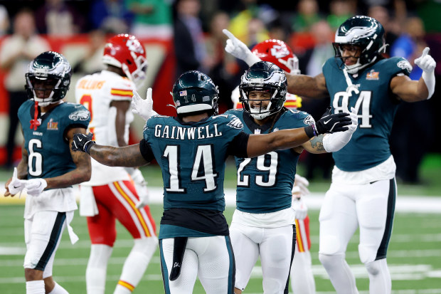 NEW ORLEANS, LOUISIANA - FEBRUARY 09: Kenneth Gainwell #14 and Avonte Maddox #29 of the Philadelphia Eagles celebrate after beating the Kansas City Chiefs 40-22 to win Super Bowl LIX at Caesars Superdome on February 09, 2025 in New Orleans, Louisiana. (Photo by Emilee Chinn/Getty Images)